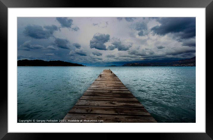 Wooden pier on the Adriatic sea. Stormy weather. Framed Mounted Print by Sergey Fedoskin