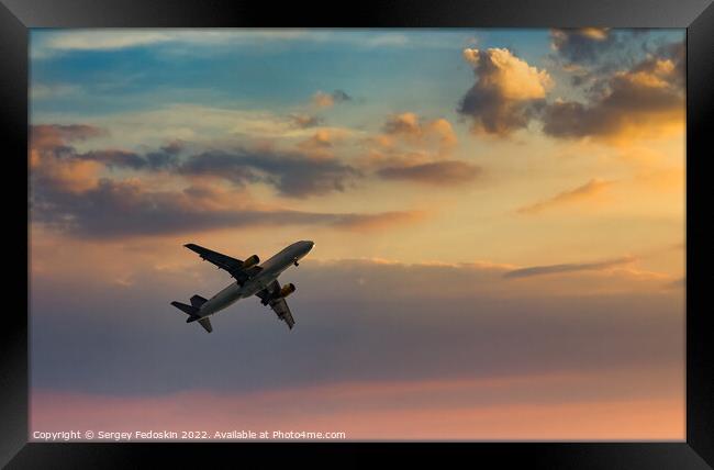 Passenger plane in the beautiful sky - Air travel Framed Print by Sergey Fedoskin