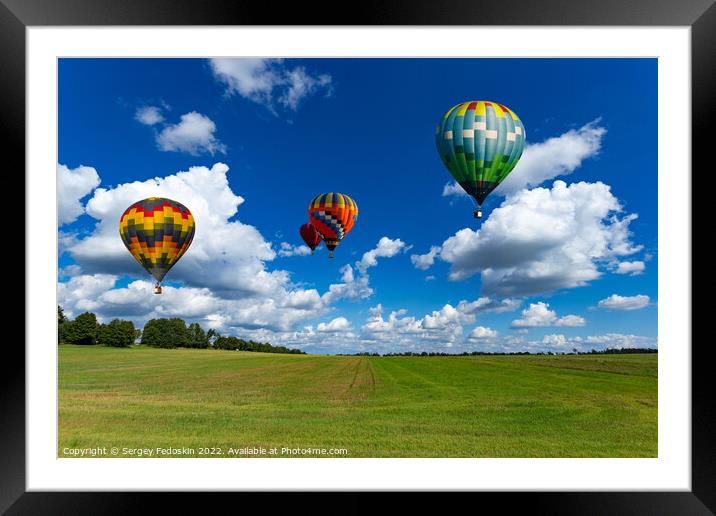Colorful hot air balloons over green rice field. Framed Mounted Print by Sergey Fedoskin