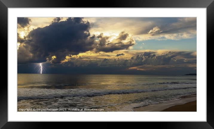 Dramatic dark stormy sky and lightning over a sea Framed Mounted Print by Sergey Fedoskin