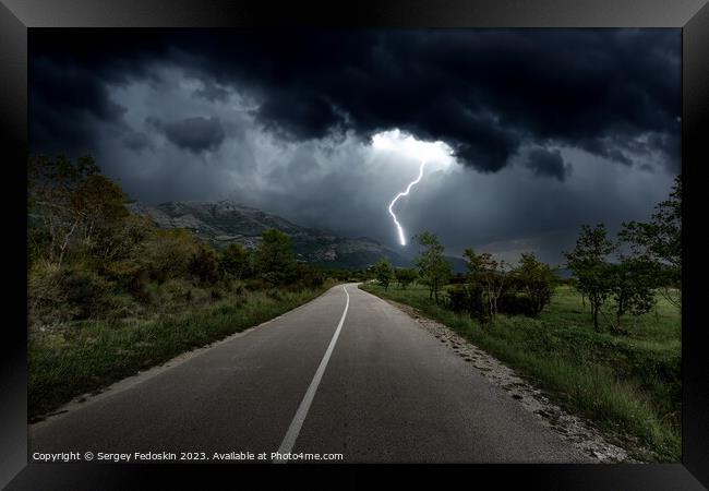 Lightning over mountains road Framed Print by Sergey Fedoskin