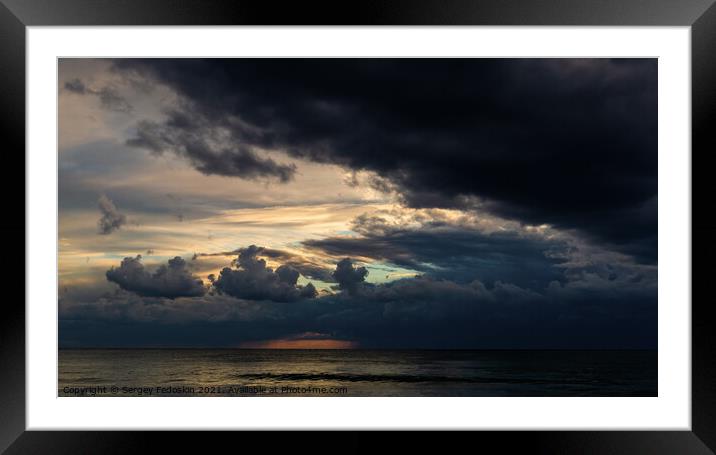 Coast of a sea and dramatic sky. Evening time. Stormy weather. Framed Mounted Print by Sergey Fedoskin