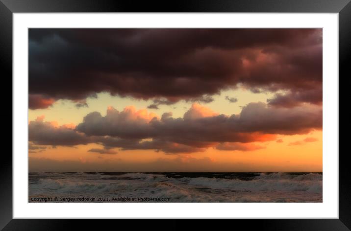 Cloudy sunset at the stormy sea. Framed Mounted Print by Sergey Fedoskin