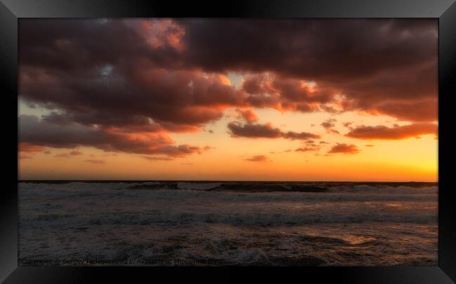 Cloudy sunset at the stormy sea. Framed Print by Sergey Fedoskin