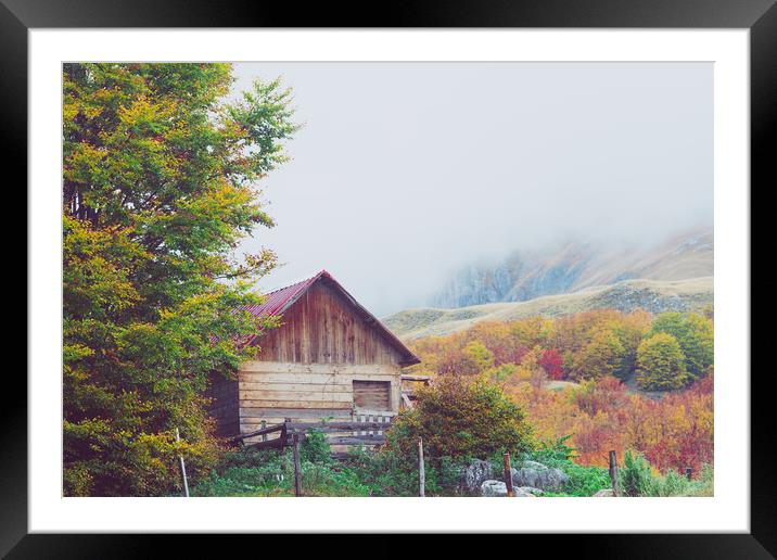 Mountains in autumn. Abandoned warehouse. Framed Mounted Print by Tartalja 