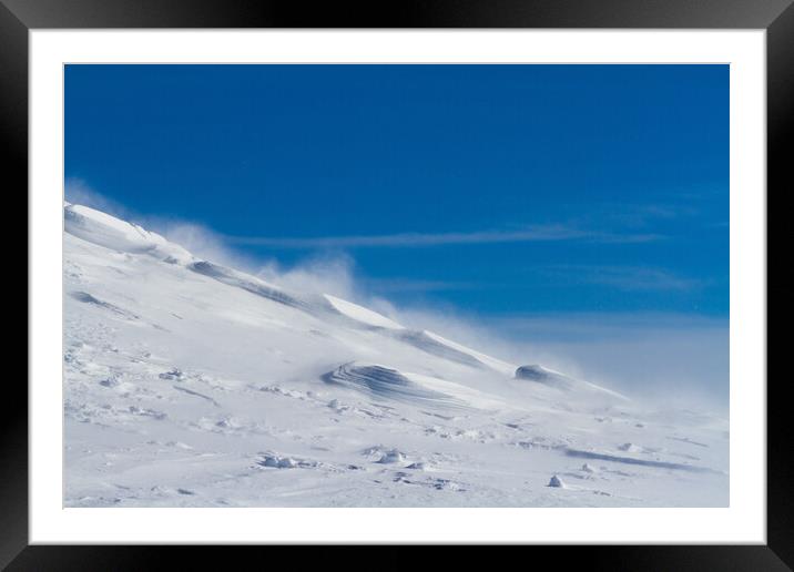 Snowy mountain slope with wind, winter background Framed Mounted Print by Tartalja 