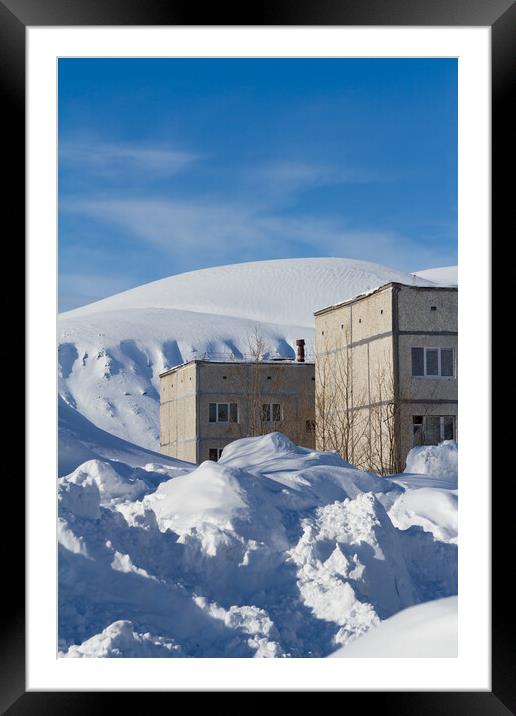 Snow-covered houses beyond the Arctic Circle in winter Framed Mounted Print by Tartalja 