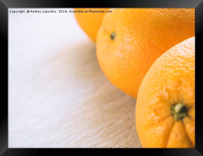 oranges on wooden background. Framed Print by Andrey Lipinskiy