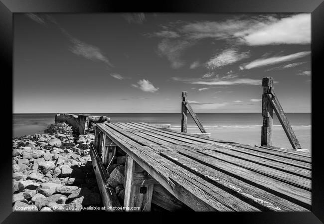 Old breakwater at Lossiemouth beach Framed Print by Joe Dailly
