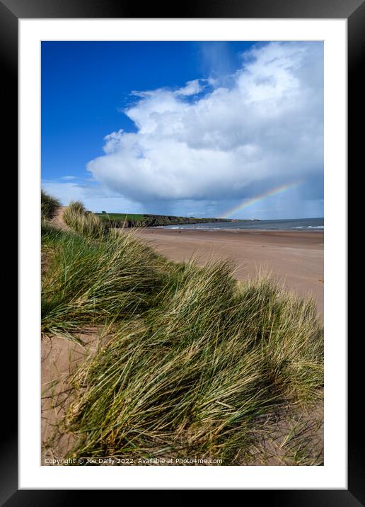 A stunning rainbow over Luananbay beach Framed Mounted Print by Joe Dailly