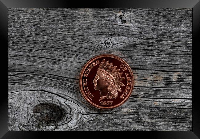 Single US Indian head one cent coin on rustic wood for numismati Framed Print by Thomas Baker