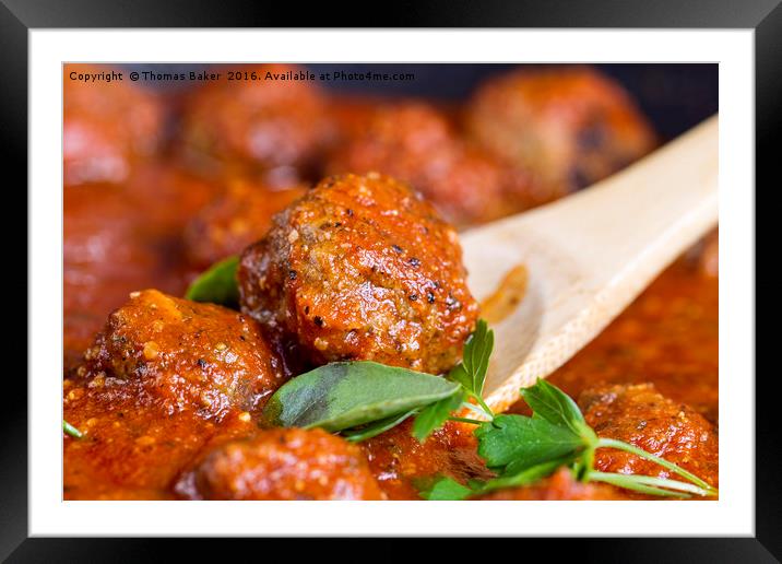 Freshly cooked meatballs in red sauce  Framed Mounted Print by Thomas Baker