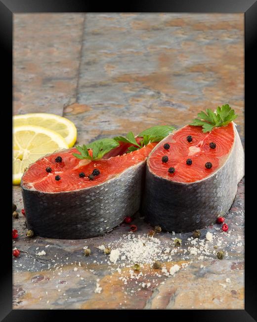 Fresh Raw Salmon Steaks ready for cooking  Framed Print by Thomas Baker