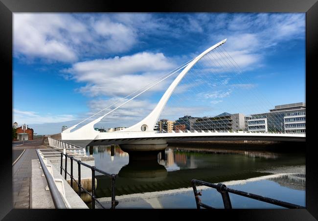 Modern cable bridge over the River Liffey in Irela Framed Print by Thomas Baker