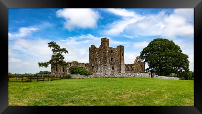 Old castle with farm field in Ireland  Framed Print by Thomas Baker