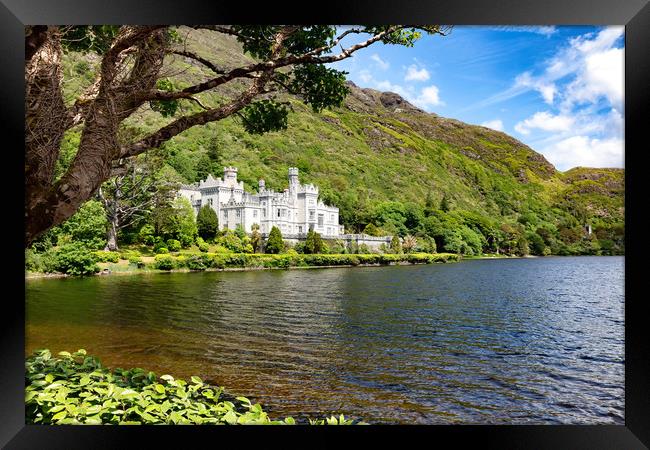 Kylemore Abbey in Connemara mountains with lake in Framed Print by Thomas Baker