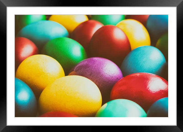 Colorful Easter Eggs In Basket Framed Mounted Print by Radu Bercan