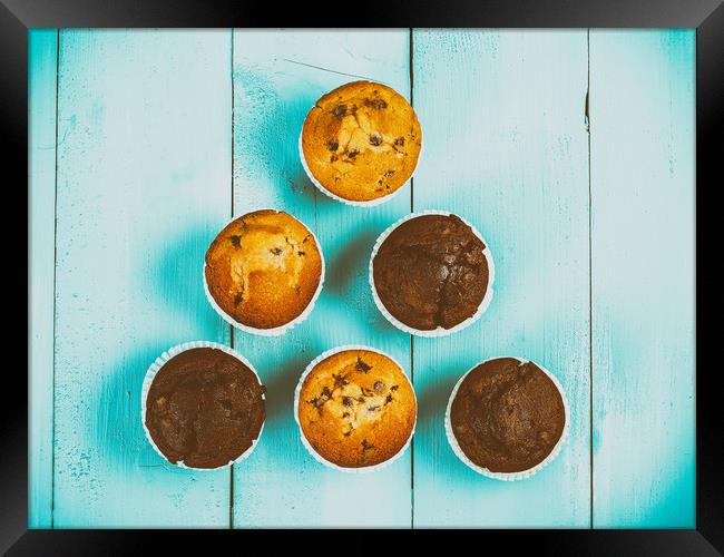 Homemade Chocolate Chip Muffins On Blue Table Framed Print by Radu Bercan