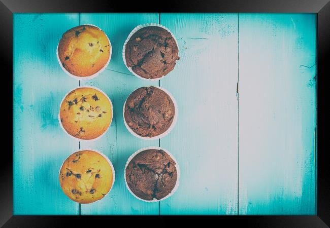 Homemade Chocolate Chip Muffins On Blue Table Framed Print by Radu Bercan