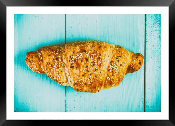 Croissant On Blue Table Framed Mounted Print by Radu Bercan