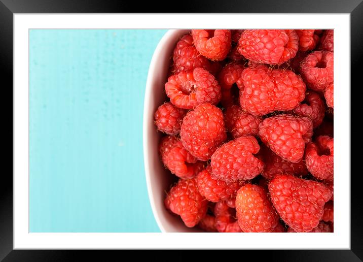 White Bowl Of Red Fresh Raspberries Framed Mounted Print by Radu Bercan