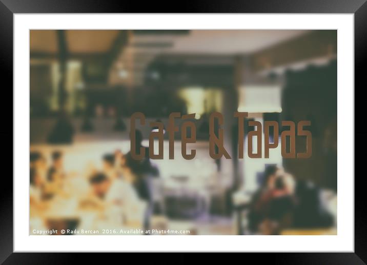 Cafe And Tapas Restaurant Sign With Blurred People Framed Mounted Print by Radu Bercan