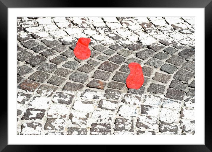 Red footsteps in town Framed Mounted Print by Massimo Lama