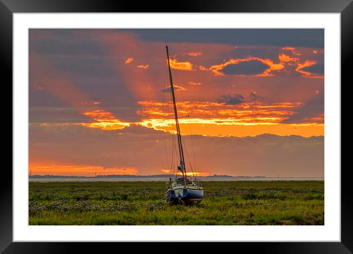A sunset over a body of water Framed Mounted Print by Kevin Elias