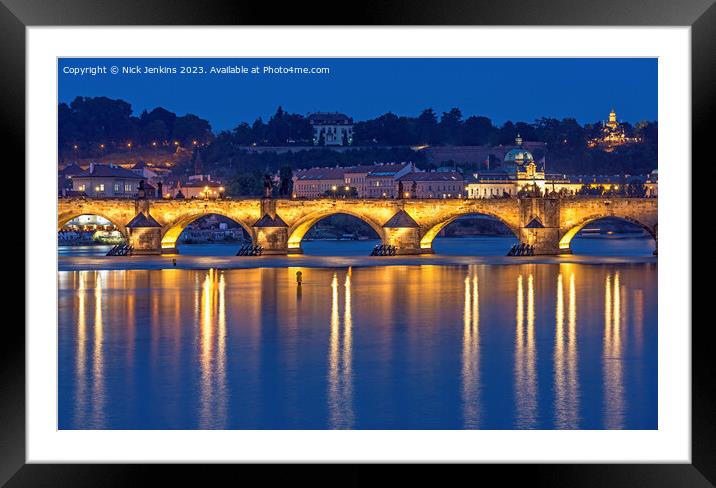 The Charles Bridge lit up over the Vltava River  Framed Mounted Print by Nick Jenkins