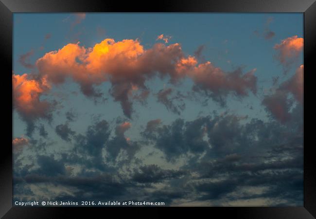 Sun Dancing Evening Clouds Framed Print by Nick Jenkins