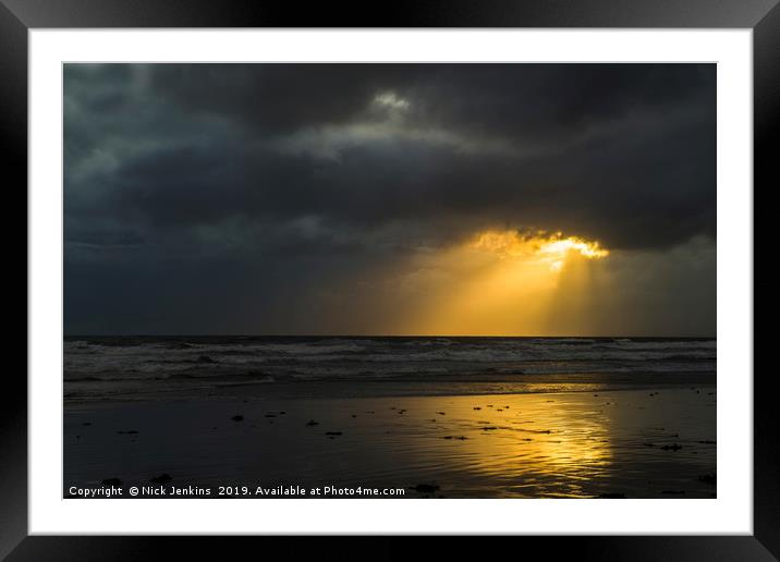 Sunlight through Dark Cloud South Wales coast Framed Mounted Print by Nick Jenkins