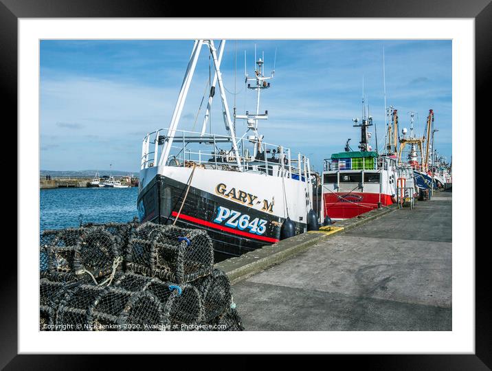 Trawlers moored up in Newlyn Harbour in Cornwall Framed Mounted Print by Nick Jenkins