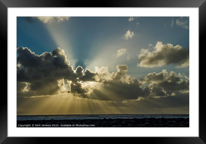 A large sunburst over Llantwit Major Beach Wales Framed Mounted Print by Nick Jenkins