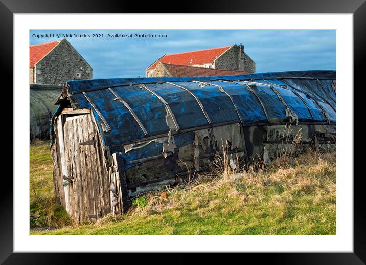 Old herring boats used as fishing sheds Lindisfarn Framed Mounted Print by Nick Jenkins