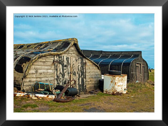 Old Herring Boats now used as sheds on Lindisfarne Framed Mounted Print by Nick Jenkins