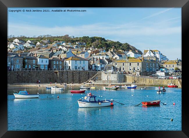 Coastal village of Mousehole across the harbour Framed Print by Nick Jenkins