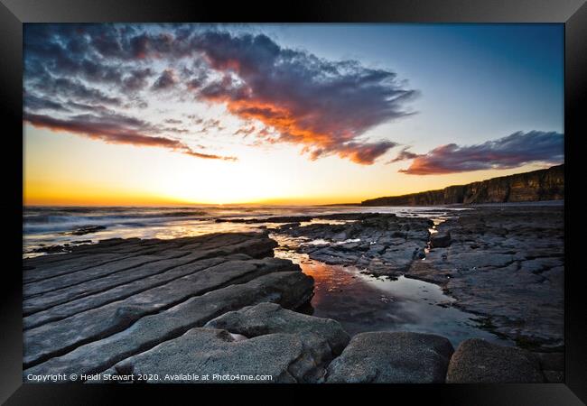 Rocks, Sea and Sunset Framed Print by Heidi Stewart