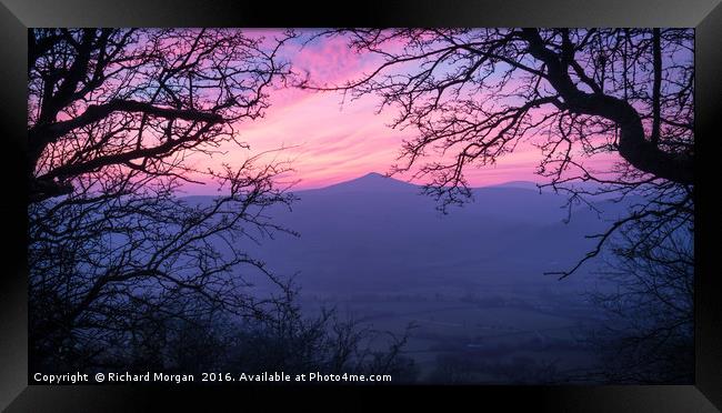 Looking through the trees at the beautiful sunset  Framed Print by Richard Morgan