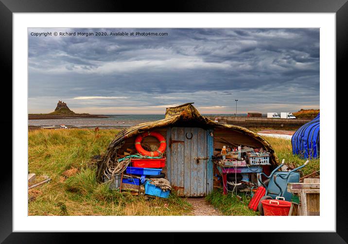 Upturned boats used as fishing shelters - on Holy Island. Framed Mounted Print by Richard Morgan
