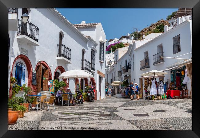 Tourists in Frigiliana in Andalusia, Spain Framed Print by Angus McComiskey