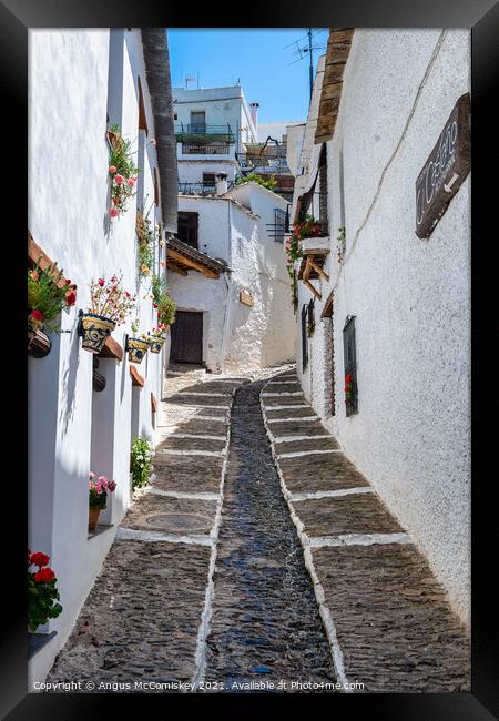 Narrow alleyway in Pampaneira, Andalusia, Spain Framed Print by Angus McComiskey