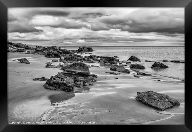Rocks on Dornoch beach mono Framed Print by Angus McComiskey