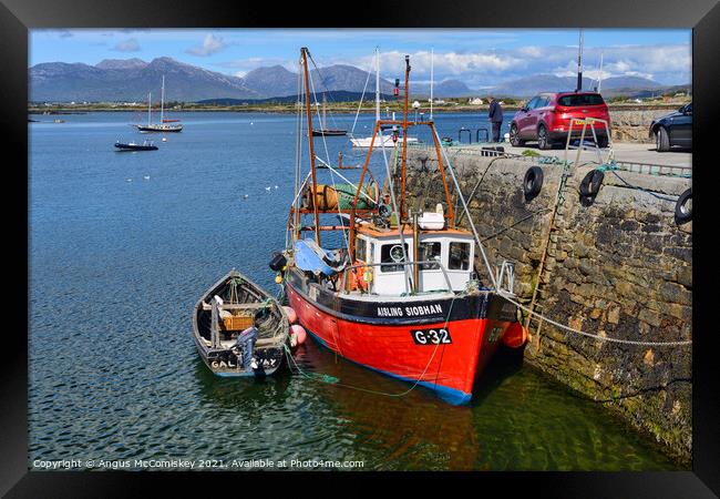 Fishing boat in Roundstone harbour, County Galway  Framed Print by Angus McComiskey