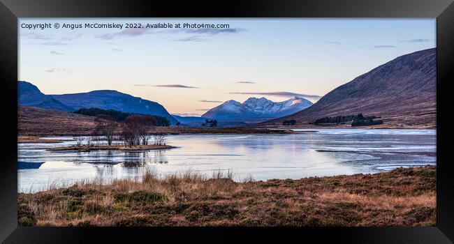 An Teallach viewed across frozen Loch Droma Framed Print by Angus McComiskey