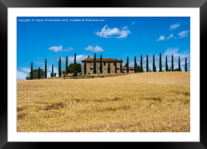 Tuscan stone farmhouse with cypress trees Framed Mounted Print by Angus McComiskey