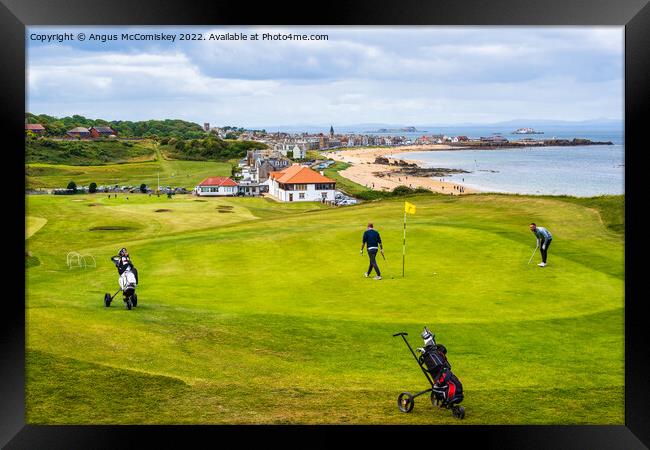 Golfers on green at Glen Golf Course North Berwick Framed Print by Angus McComiskey