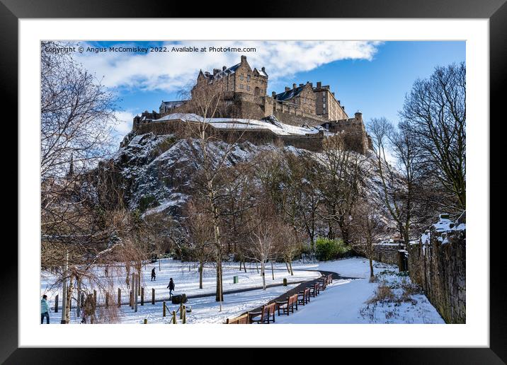 Edinburgh Castle from Princes Street Gardens snow Framed Mounted Print by Angus McComiskey
