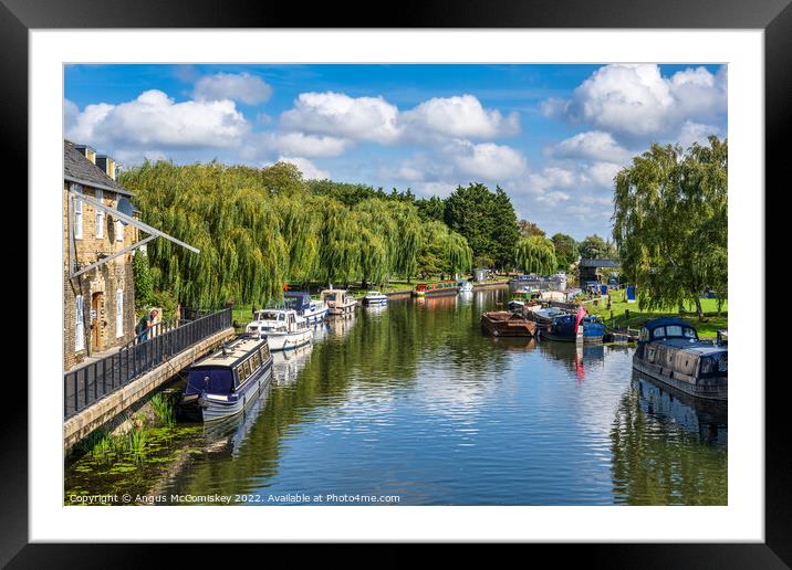 Boats moored on the River Great Ouse at Ely Framed Mounted Print by Angus McComiskey