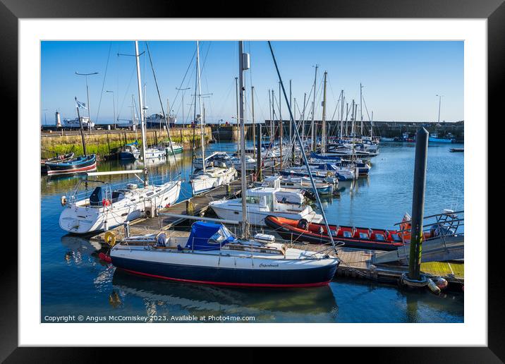 Boats moored in Anstruther harbour in Fife Framed Mounted Print by Angus McComiskey