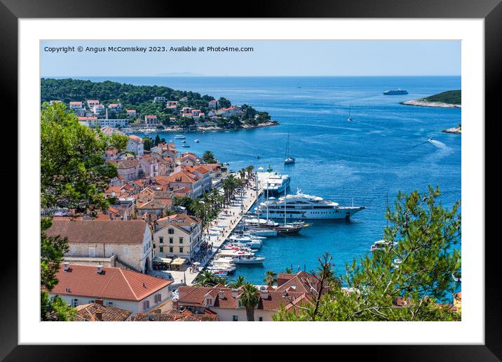 Boats on Riva waterfront in Hvar town, Croatia Framed Mounted Print by Angus McComiskey